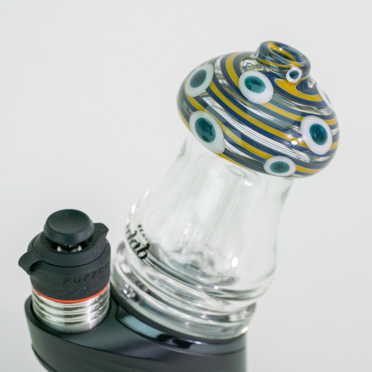 Glass smoking accessory with a black and gray base on a white background