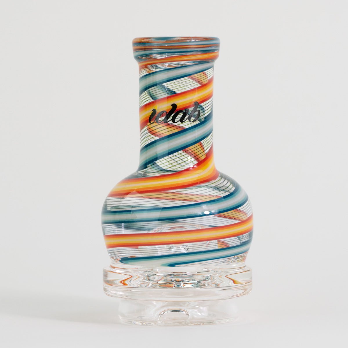 Colorful glass vase with striped pattern on a white background