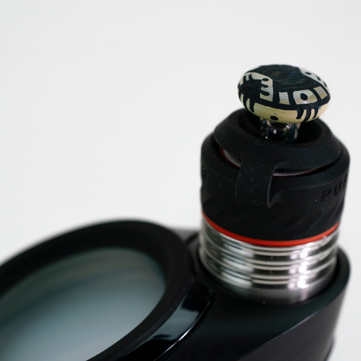 closeup of corkis portal engraved joystick on white background