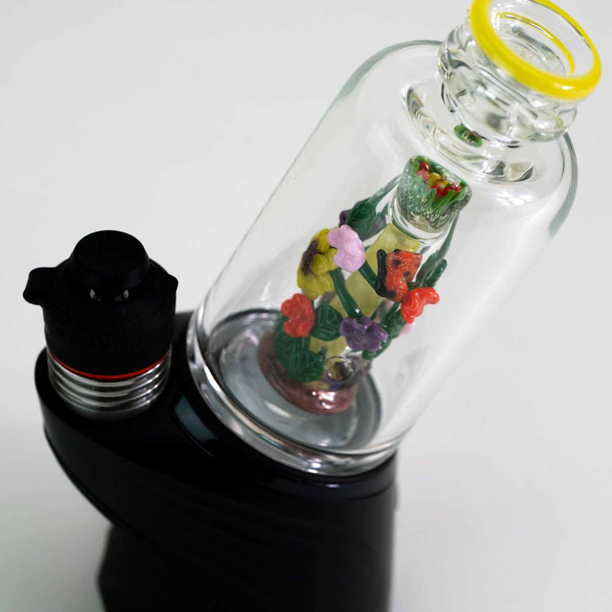 Decorative garden glass attachment on Puffco device with white background