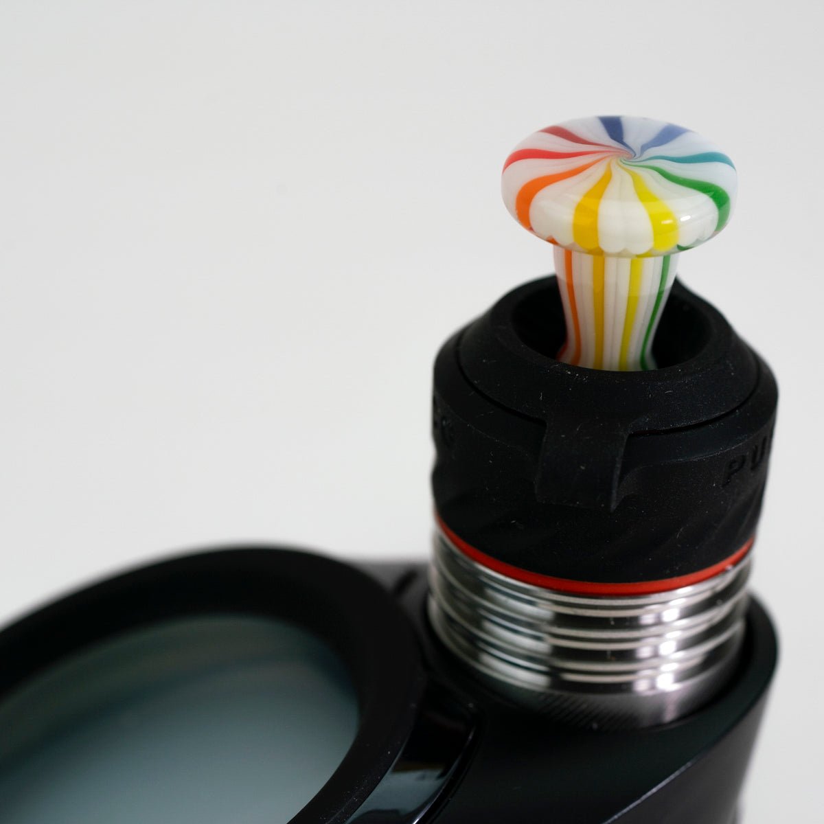 Closeup of rainbow glass joystick on white background
