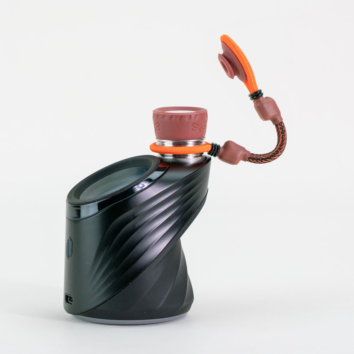 Brown and orange tether attachment on black puffco device