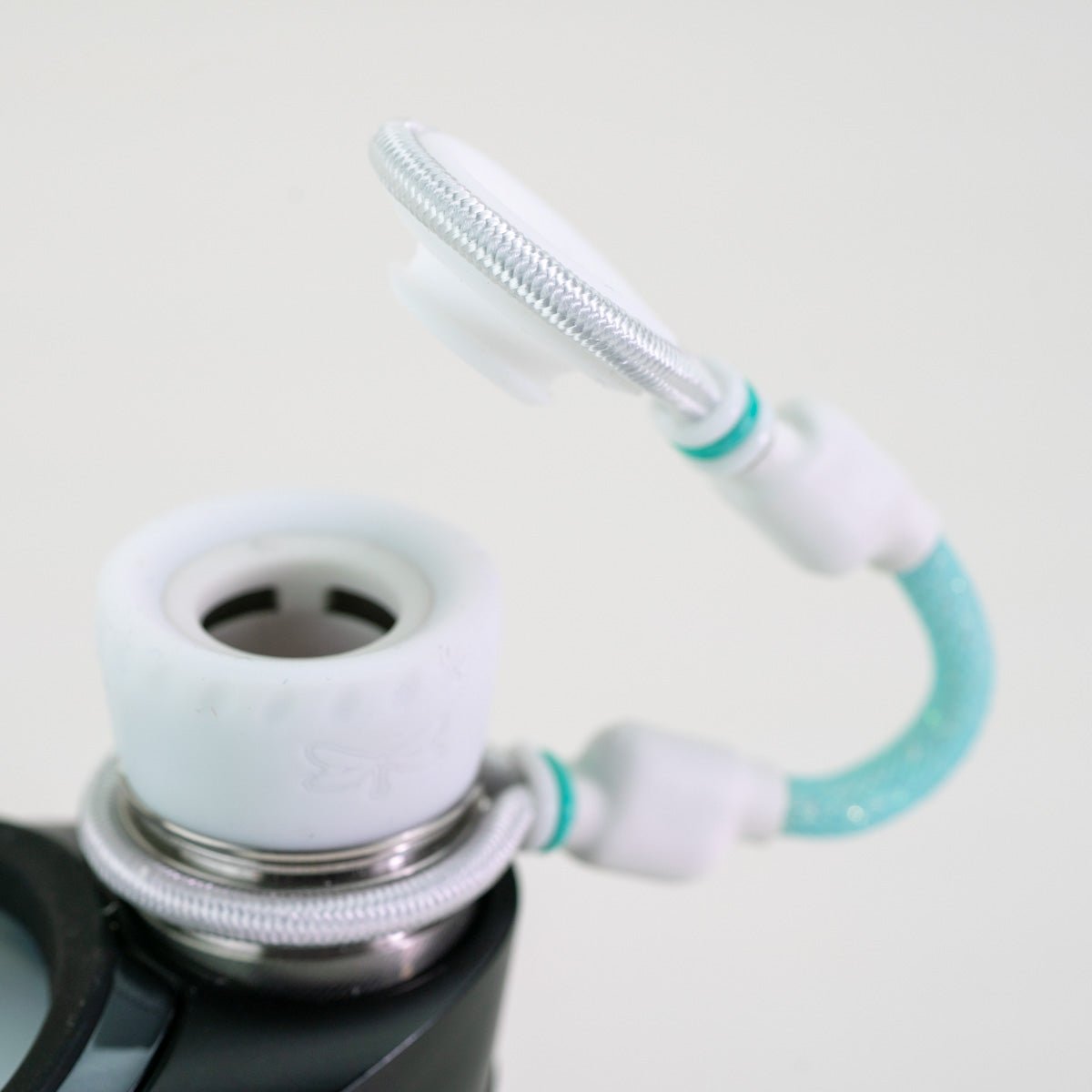 White and blue Puffco accessory on white background