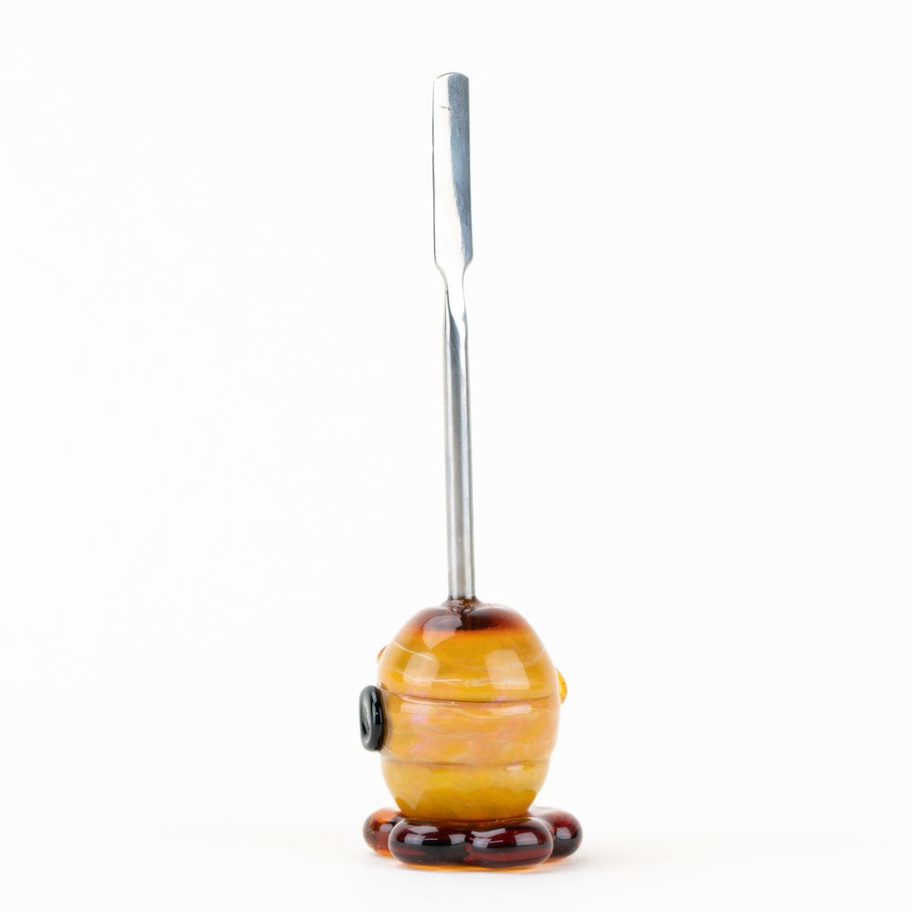 Amber honey dabber for concentrates with raised glass honeycomb detail