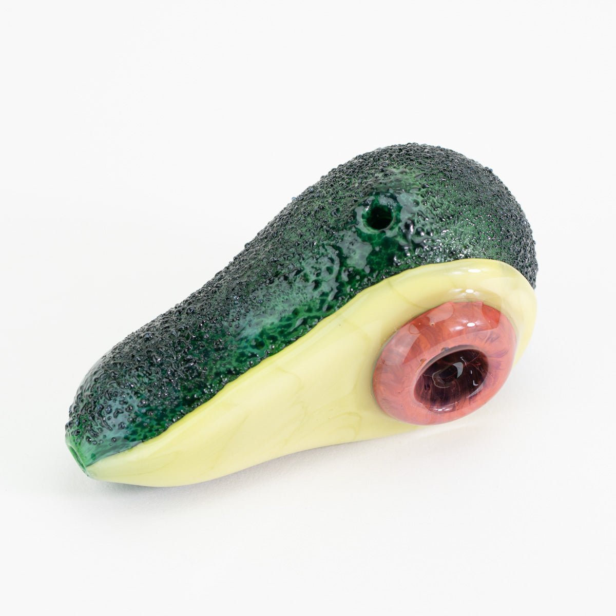An avocado dry pipe with hole pit on white background