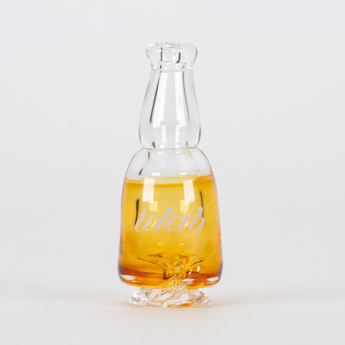 Beer Me Pivot glass piece with amber color, clear neck, and display-worthy styling