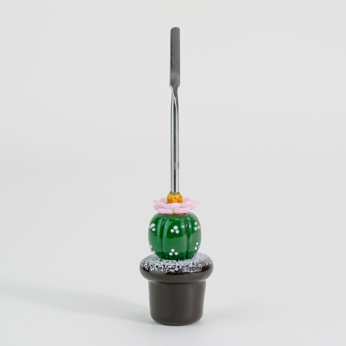 Peyote glass dabber tool with green cactus, pink flower, and black pot details