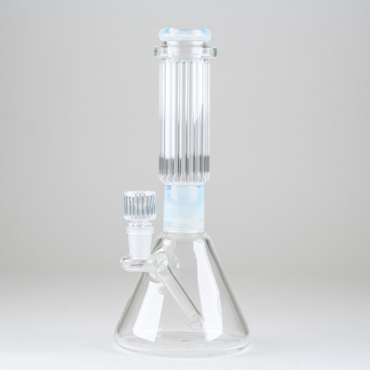 Side view of the Celeste Signature Beaker Bong showcasing its pale blue comfort rim, vertical ribbed neck, and integrated downstem