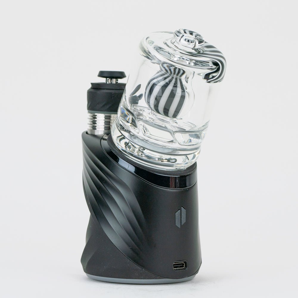 Back view of the black and white Puffco dry top attached to a Peak Pro device