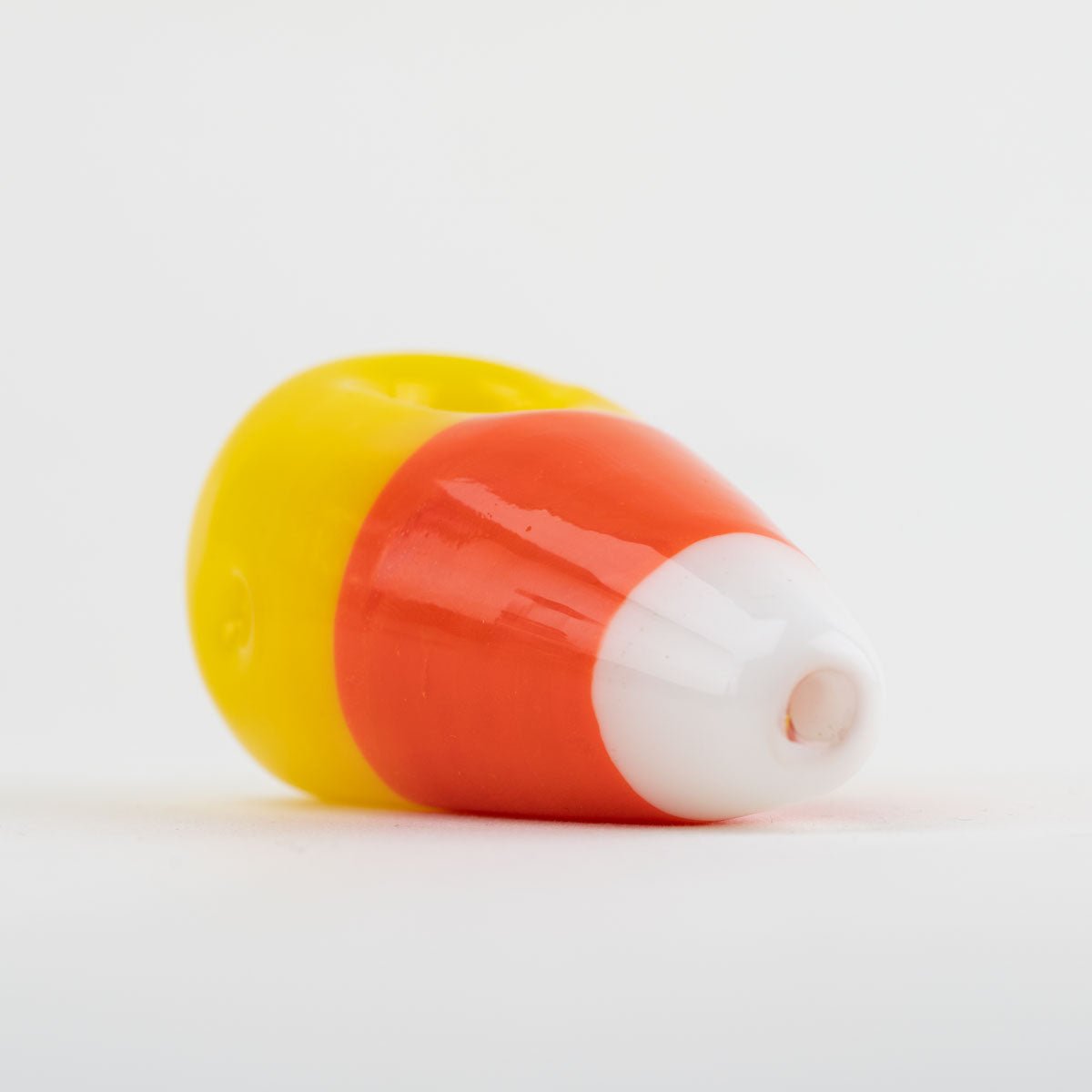 Sideview of the candy corn smoking pipe from Empire Glassworks