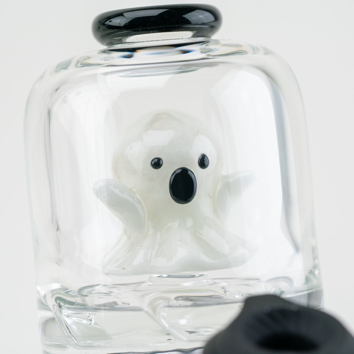 Glass attachment for the Puffco peak featuring a spooked ghost figurine