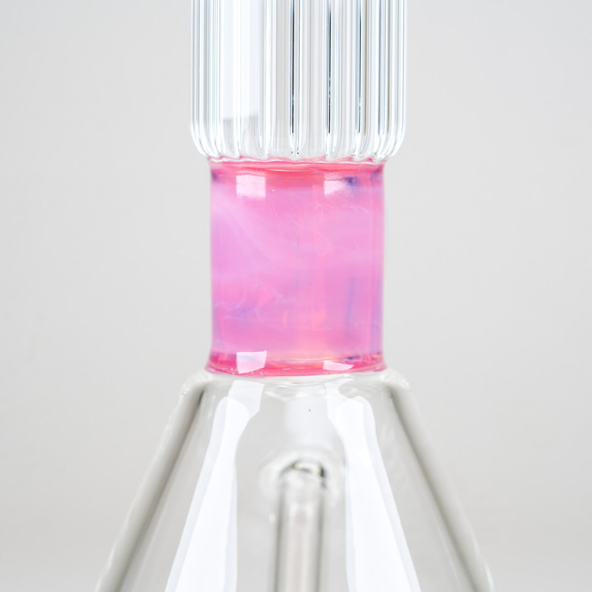 Close-up of the opalescent pink neck section and coordinating ribbed glass bowl on the Empire Glassworks Rosaline Beaker