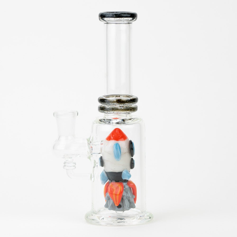 Empire Glassworks dab rig featuring a sculpted rocket ship inside the chamber