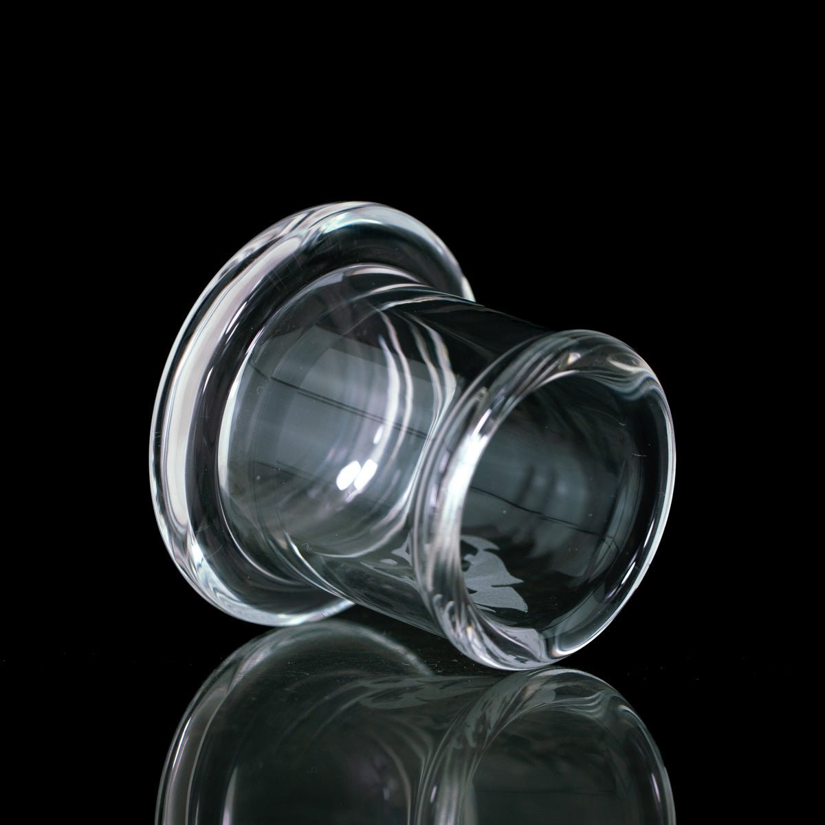 A carb cap stand on side with black background