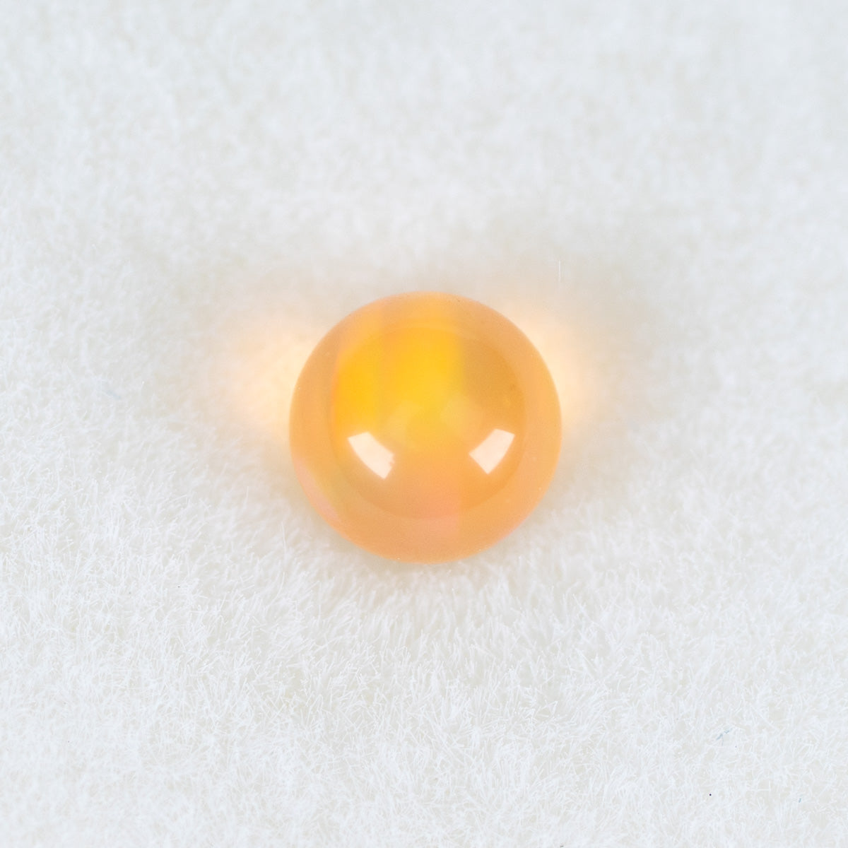 Golden opal-style 3mm terp pearl with a small rounded shape