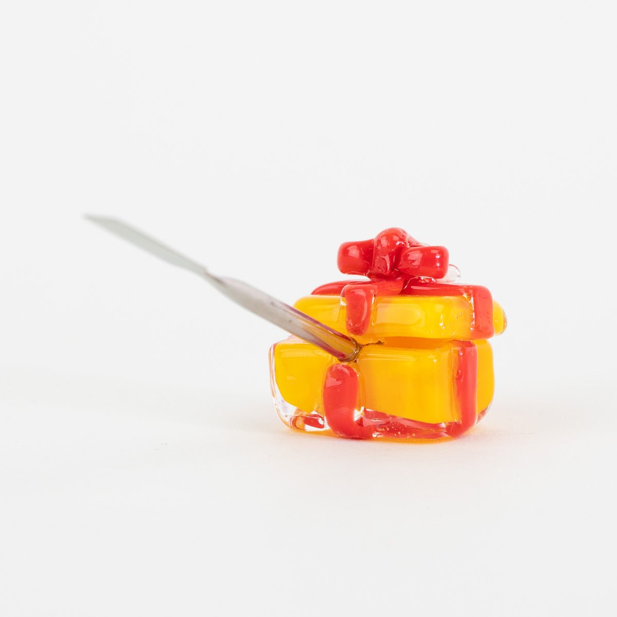 Holiday glass dab tool shaped like a wrapped gift