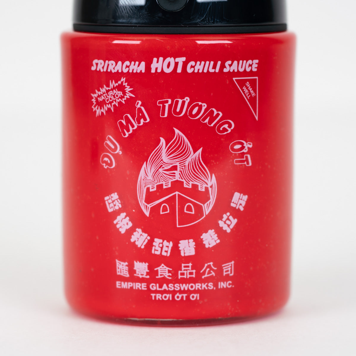 Detailed hot sauce bottle artwork on the Empire Glassworks Proxy Core attachment