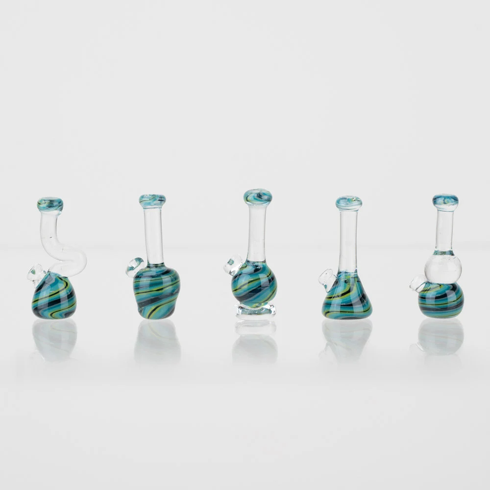 A five piece lego bong set. Each lego bong is made of glass and has a blue and black swirl design.