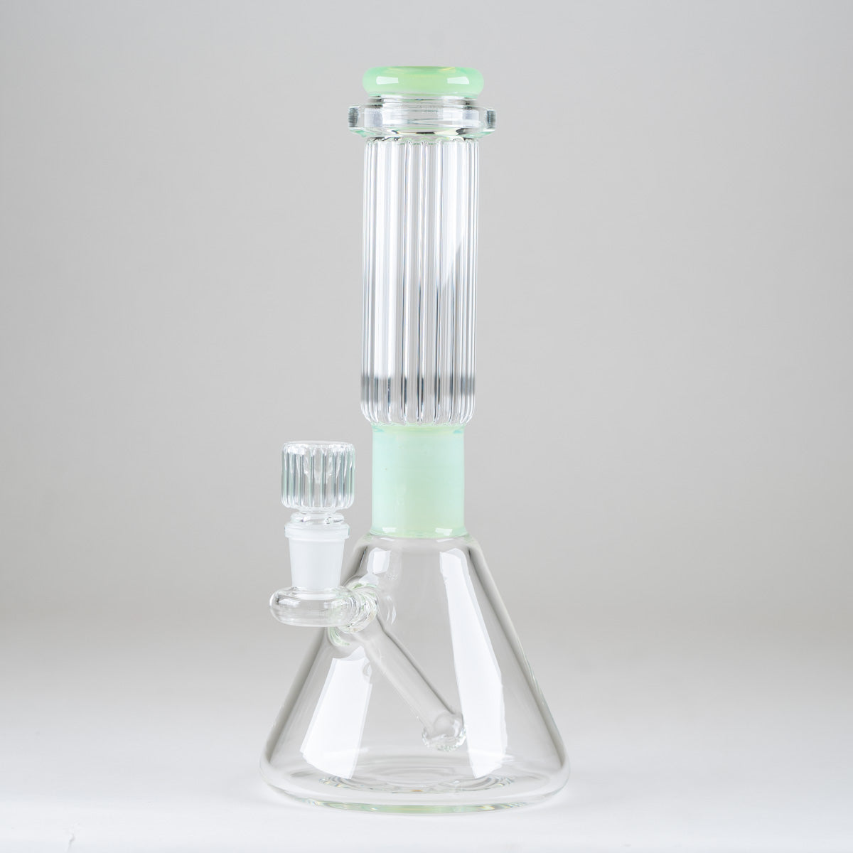 Side view of the Julep Signature Beaker Bong showcasing its mint-green comfort rim, ribbed neck, and integrated glass downstem