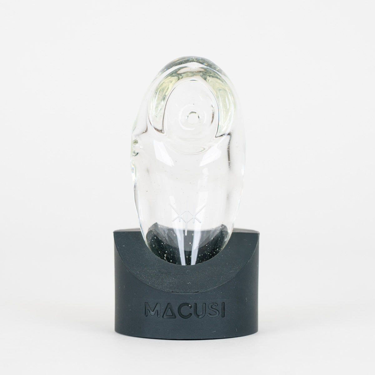 Macusi Auroras clear handmade glass pipe on black, branded stand on white background