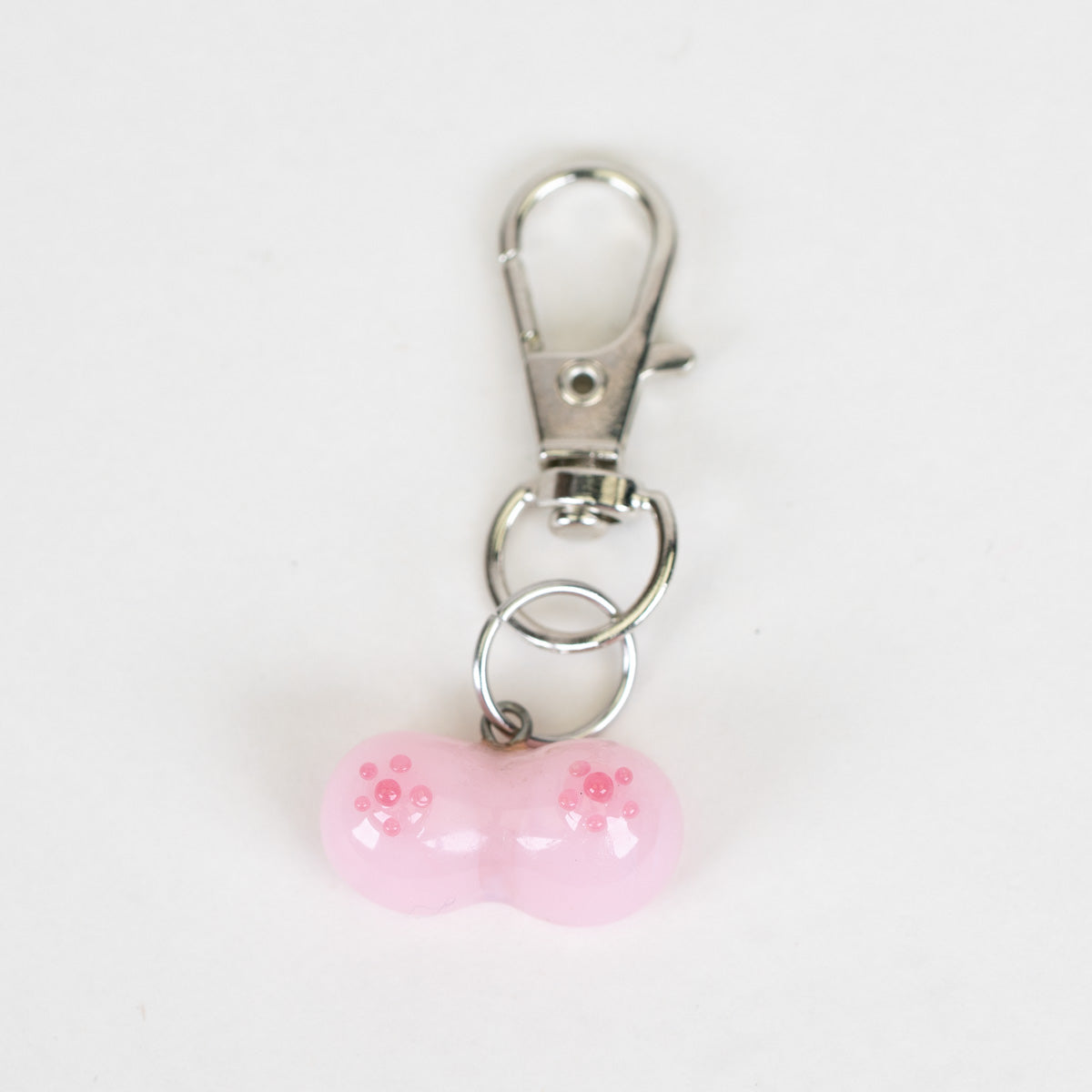 Mmmelty Boobies glass Puffco charm in pale pink with silver clip