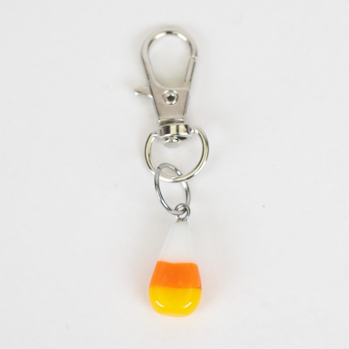Mmmelty Candy Corn glass Puffco charm with white, orange, and yellow layers