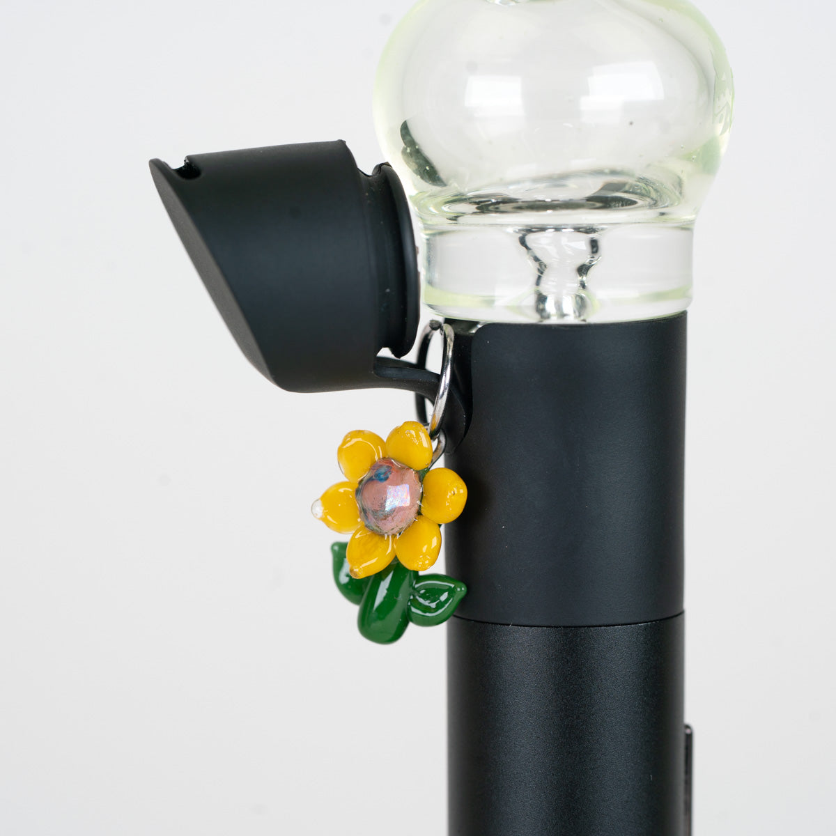 Mmmelty Glass Puffco Charm with a sunflower design
