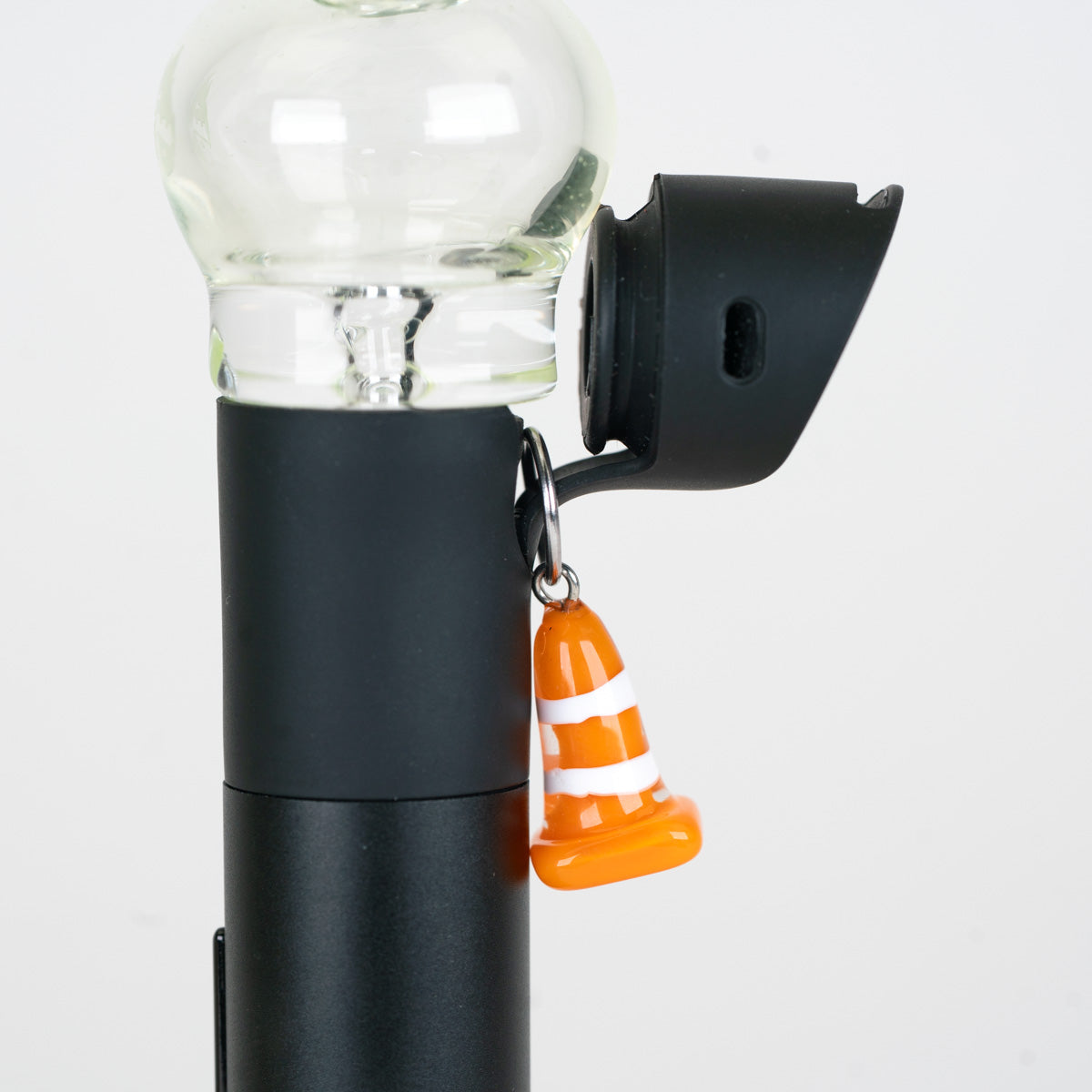 Mmmelty Glass Puffco Charm featuring an orange traffic cone design