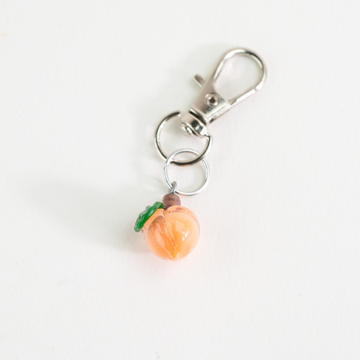 Peach glass Puffco charm with a soft fruit-inspired design