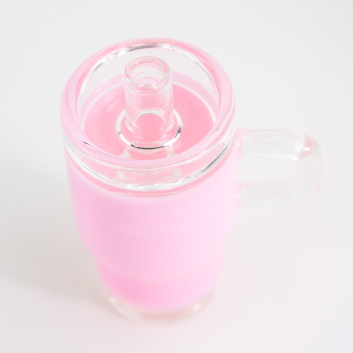 Pink tumbler-style Puffco Peak glass attachment shown from the top