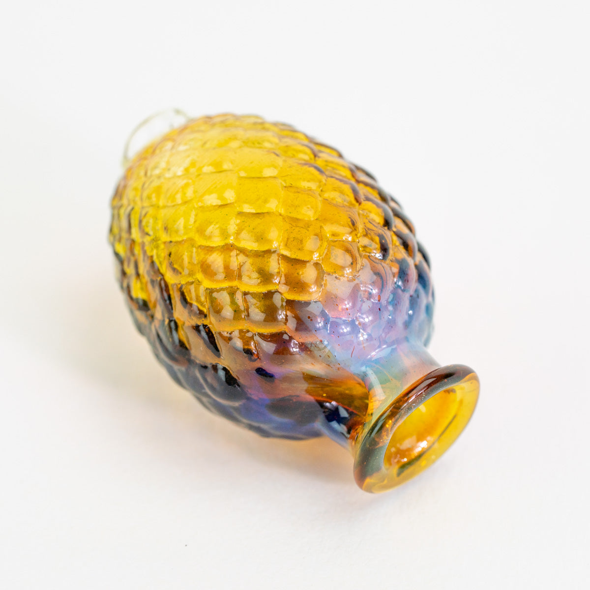 Puffco Pivot dragon egg top in warm amber tones
