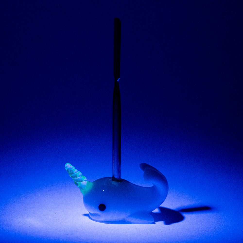 Radioactive Narwhal glass dabber with sculpted horn, black eye detail, and compact body