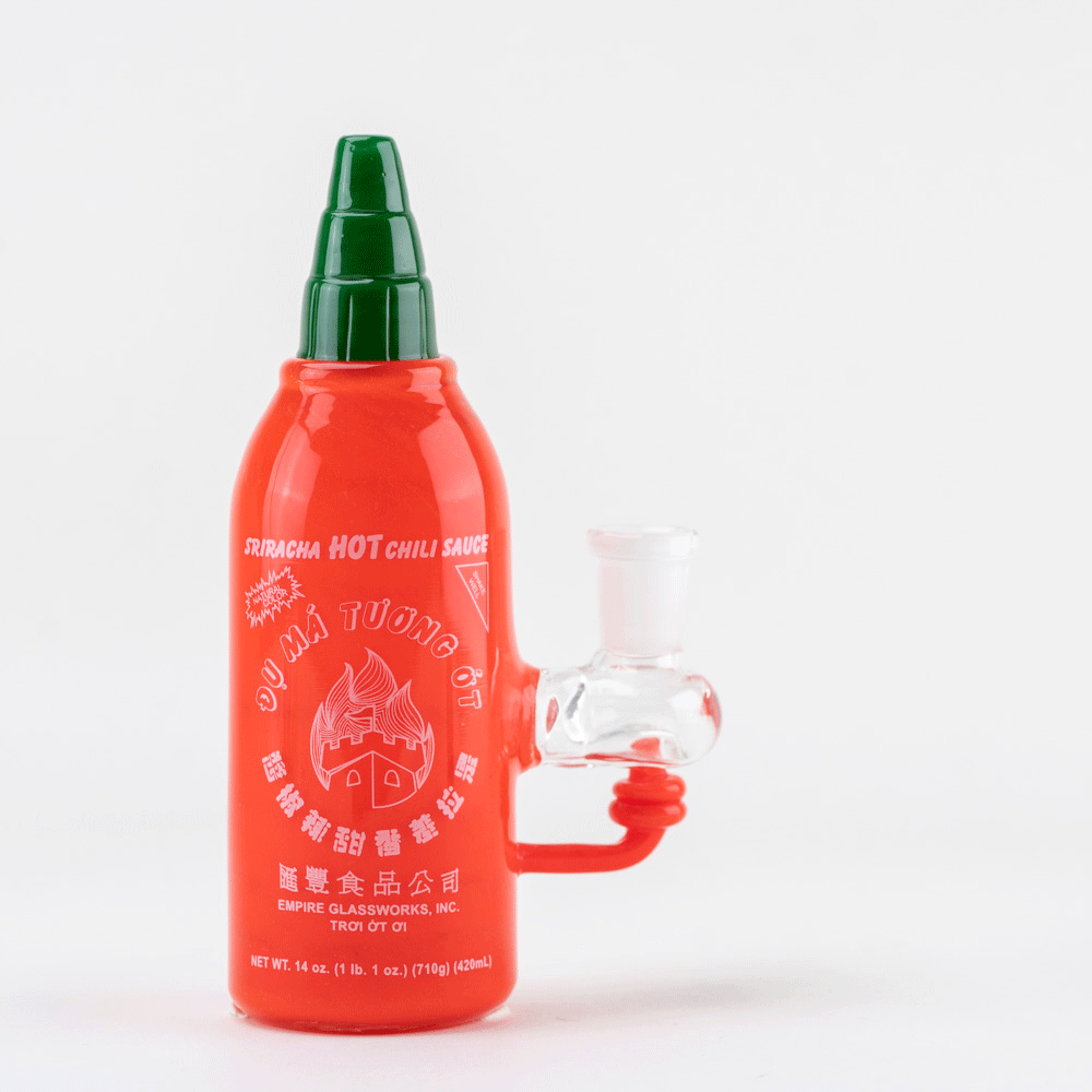 A glass sriracha sauce mini rig on white background