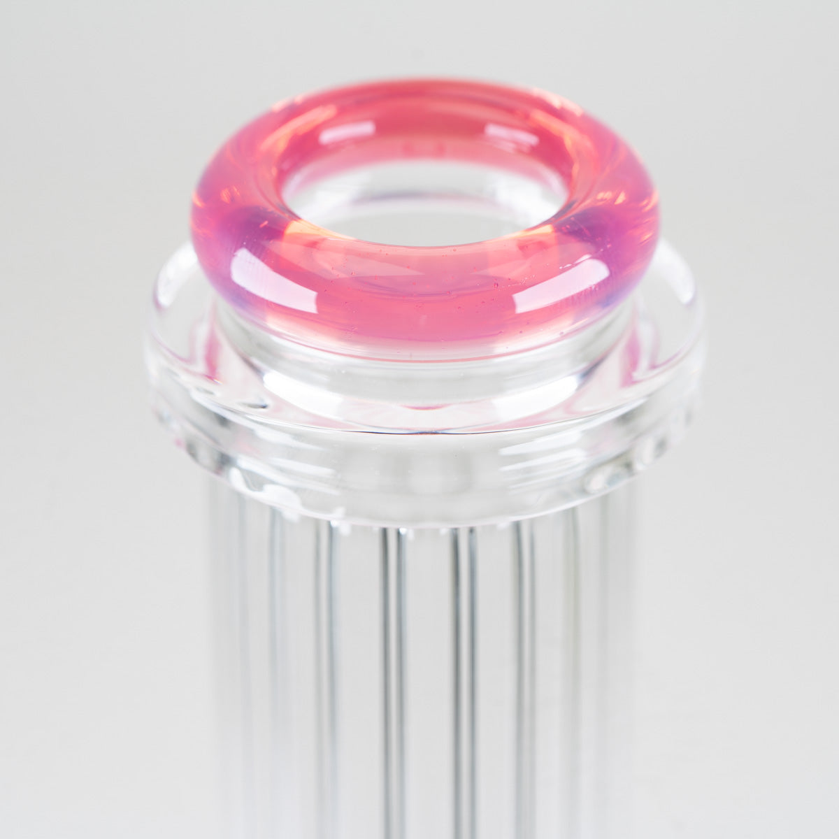 Close-up of the translucent rose-pink comfort rim mouthpiece and clear glass collar on the Rosaline Signature Beaker
