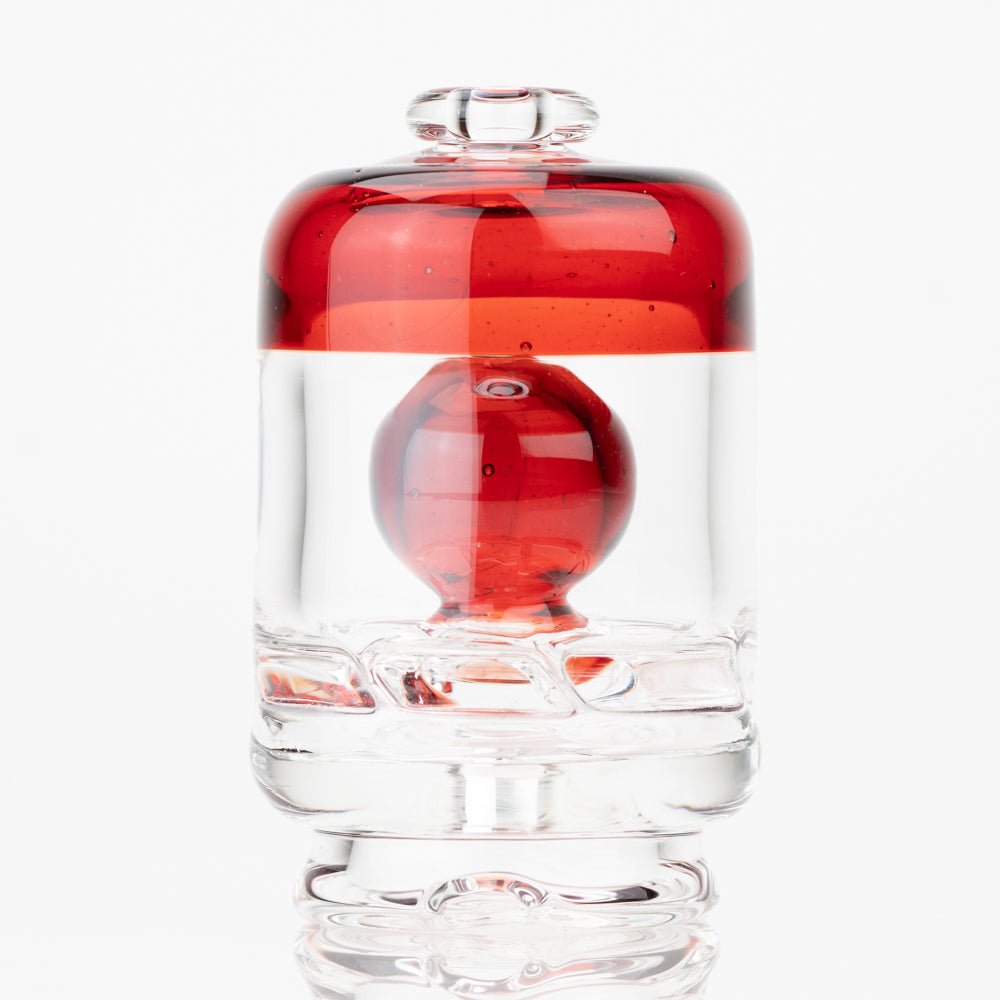 Ruby Red Puffco Peak Pro dry top attachment shown with bold red glass detail
