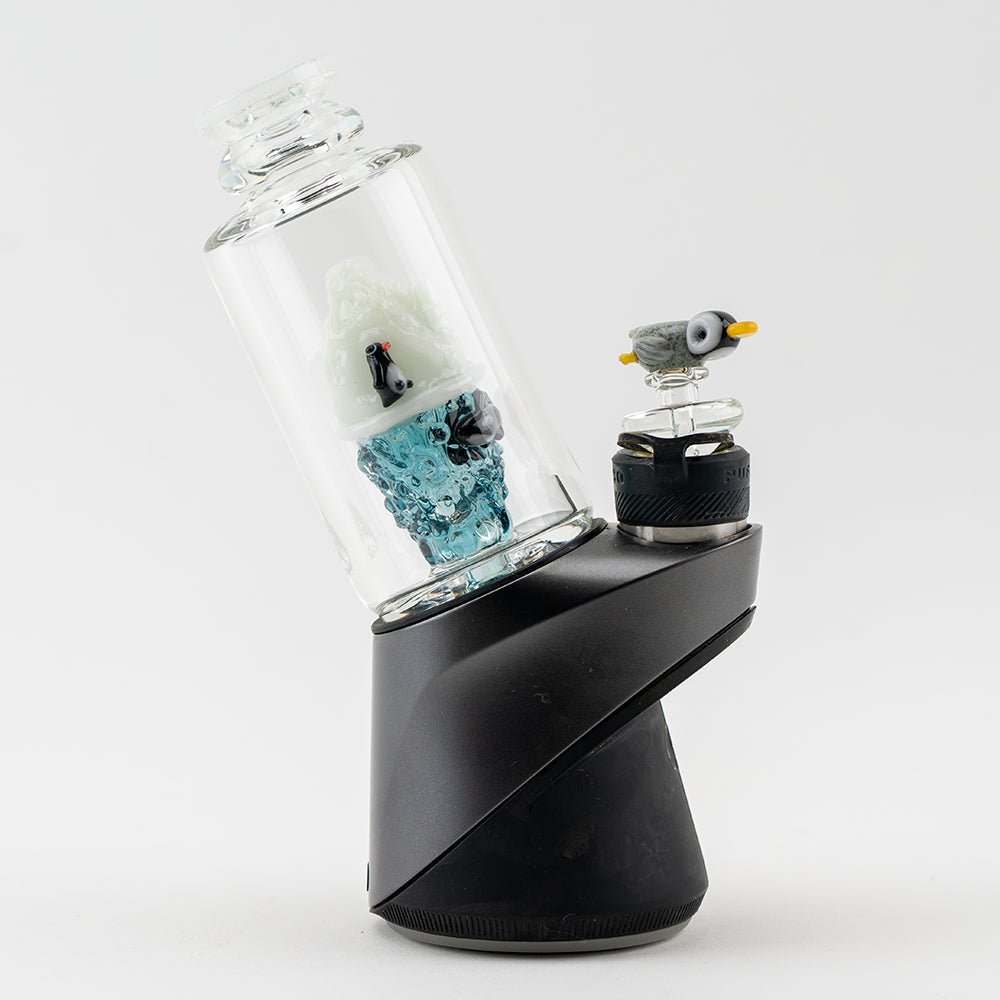 Avenge the Arctic glass attachment installed on Puffco Peak base