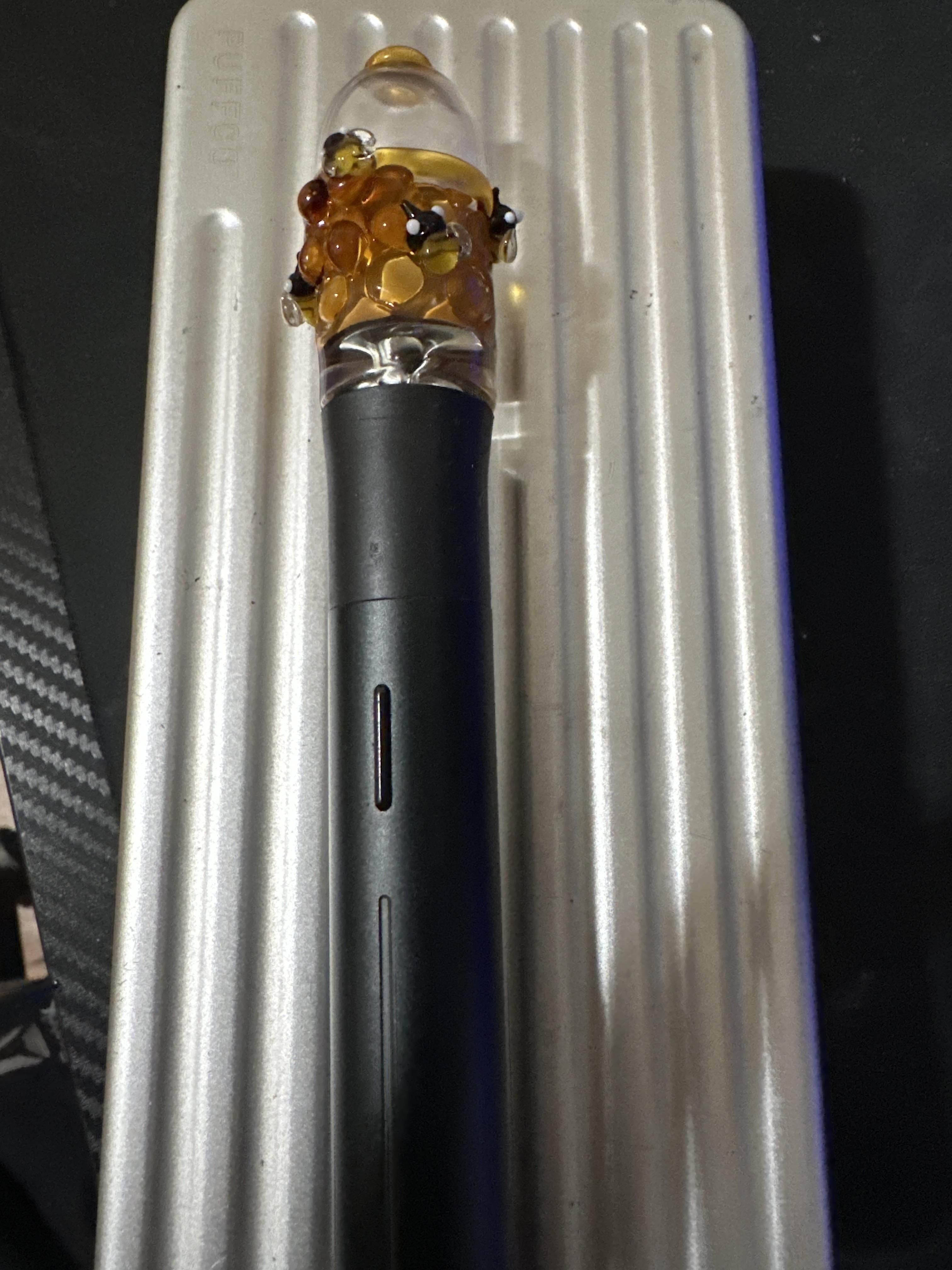 A beehive themed glass attachment for the Puffco Piot Device