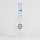 Clear glass bottle with a blue cap and decorative label on a white background
Details