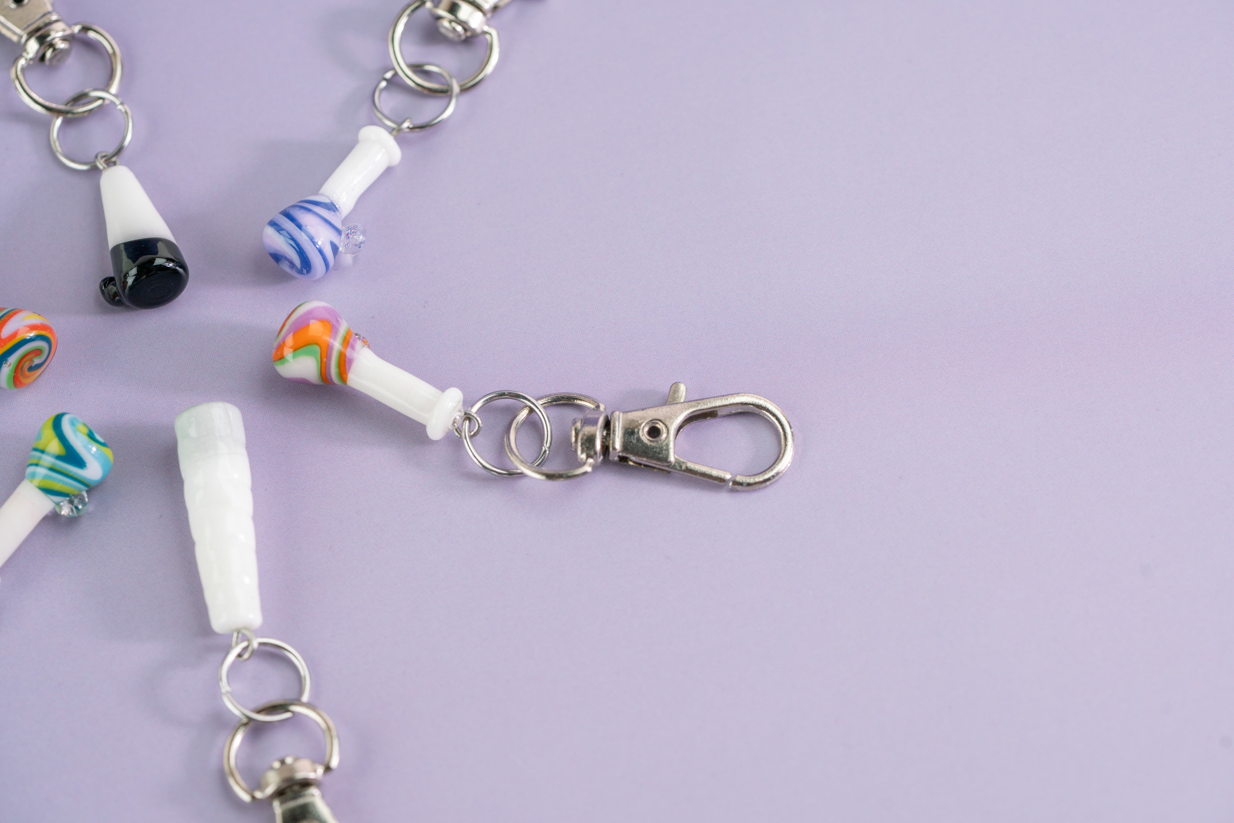 Keychain with colorful beads on a light purple background