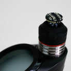 closeup of glass engraved joystick with puffco device