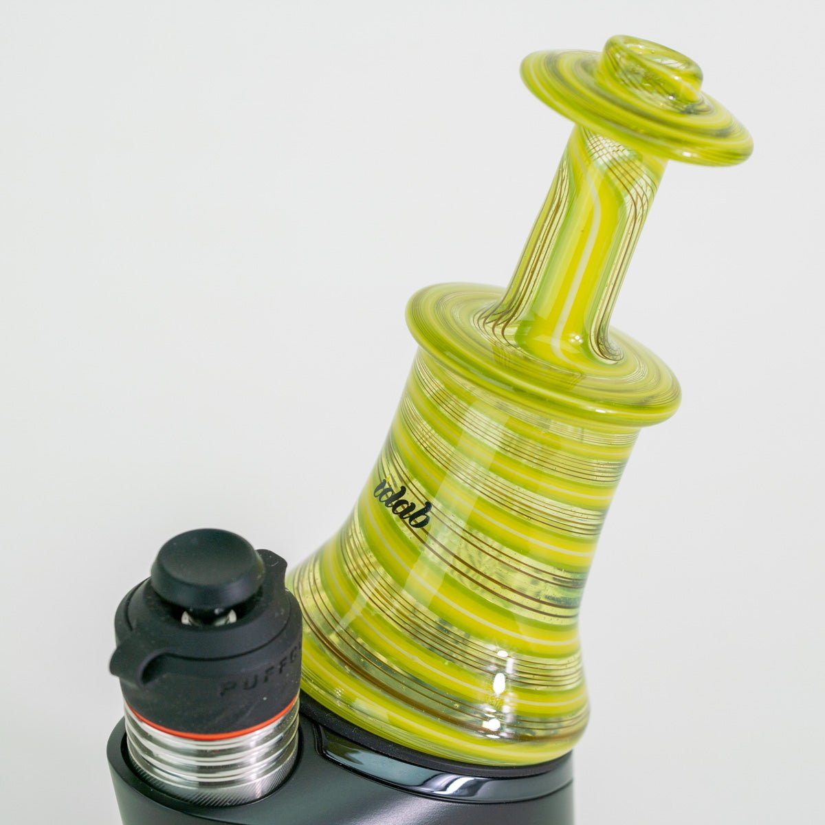 Glass smoking device with black and red accents on a white background