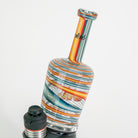 Colorful glass pipe with swirl pattern on a white background
