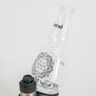 Glass Puffco attachment with floral design on white background