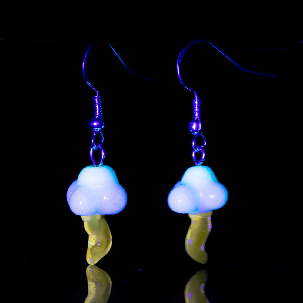 Two dangle style earrings shaped resembling a cloud and lightning bolt. Under black light the two earrings glow in the dark. The cloud and lightning bolt are made of glass. The cloud is a white color glass and the lightning bolt is a yellow color. Above the cloud is a sterling silver dangle backing.