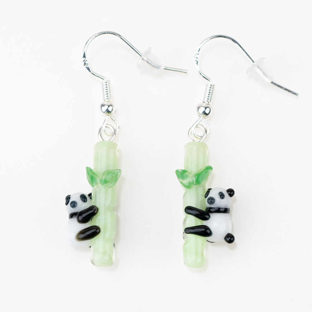 An overhead shot of the Panda Love Earrings. Panda Love Dangle Earrings - Set of Two Empire Smokes