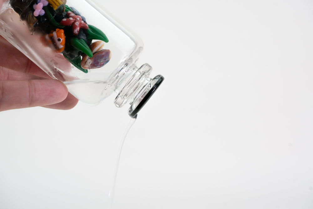 Water spilling from a fish glass attachment