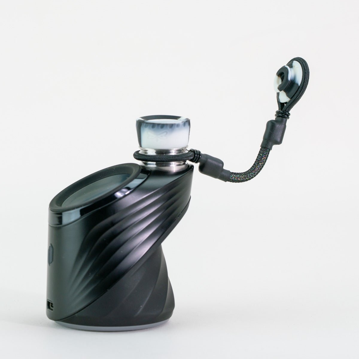 Puffco device with black and white tether attachment 