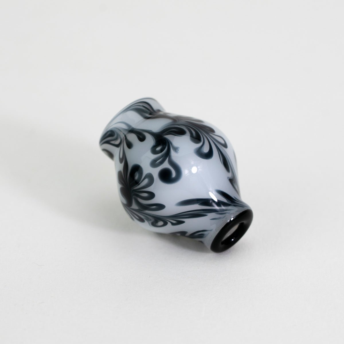 Floral patterned black and white design pivot top piece glass