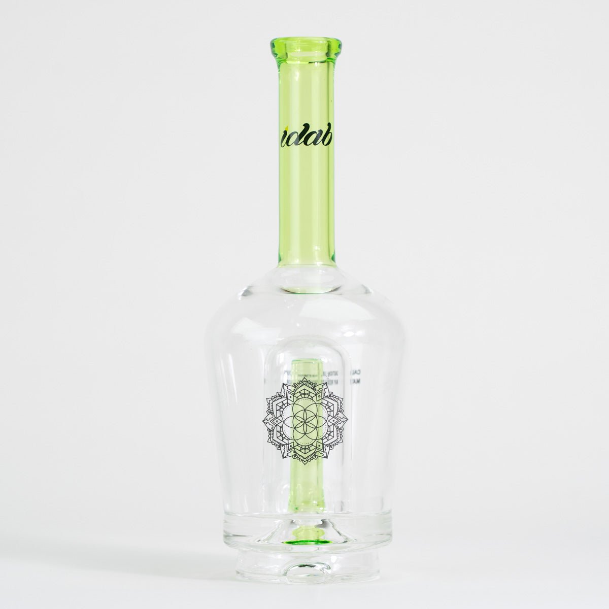 Clear glass bottle with green accent on a white background