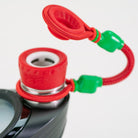 Red and green Puffco accessory with opened lid